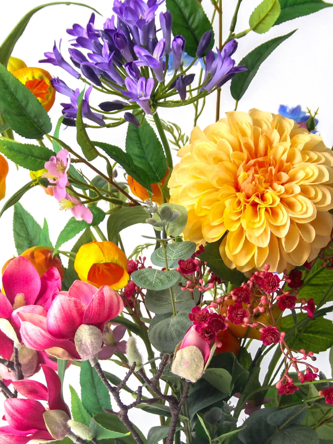 Zijden boeket Sol met oranje Sandersonia en roze Magnolia